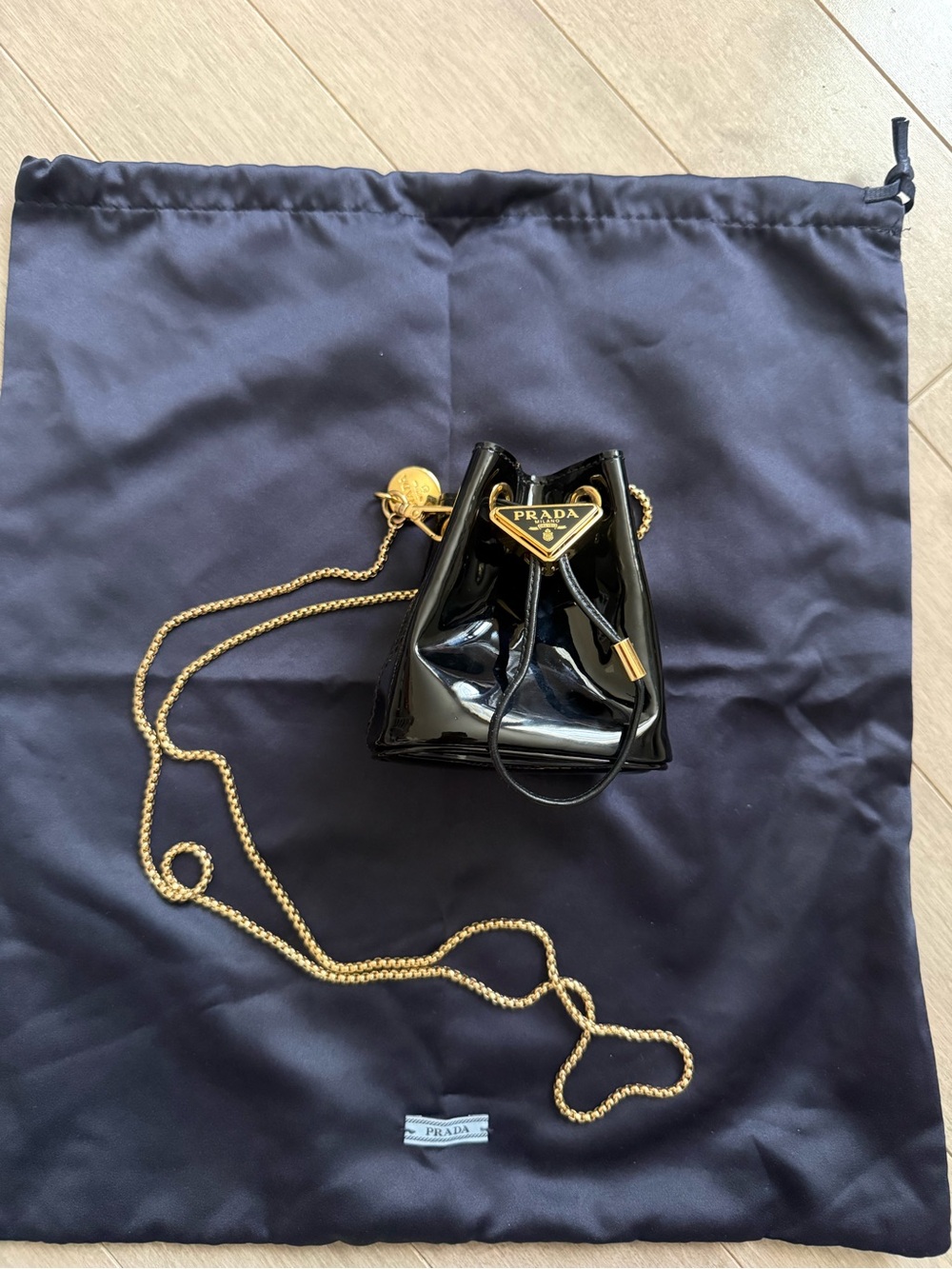 Prada Triangle Logo Black Patent Leather Mini Drawstring Bag